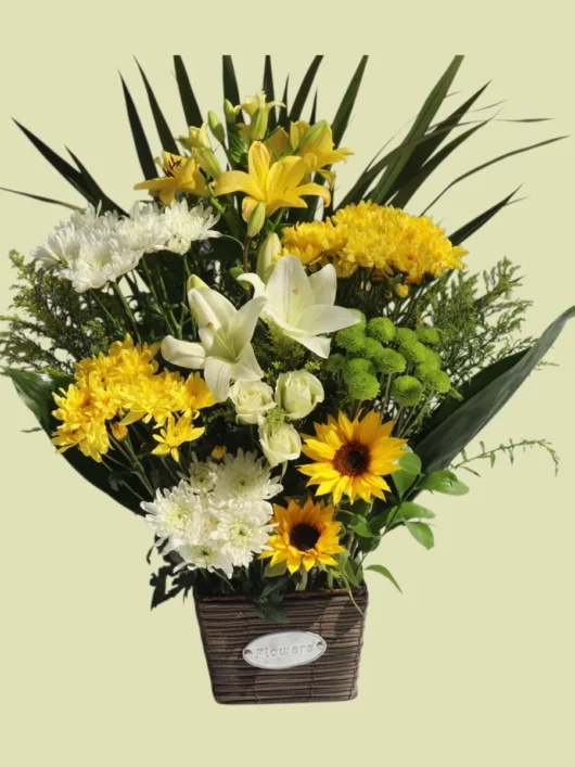 Sunrise Basket yellow flower arrangement by RosaBella Flowers
